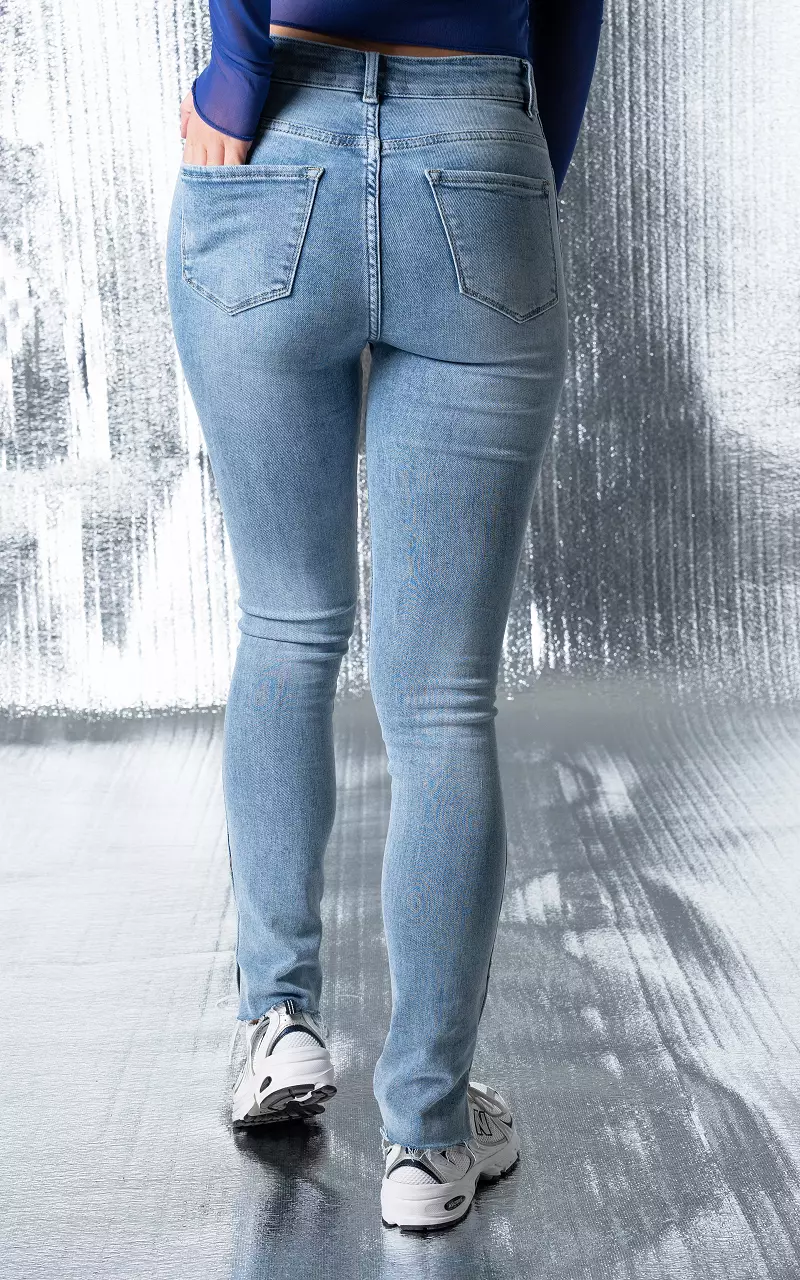 High-waist skinny jeans with split