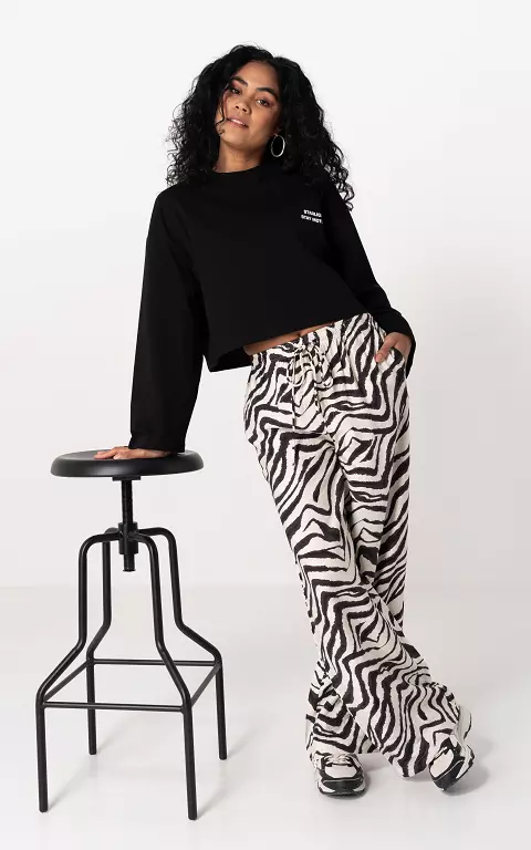 Trousers with print black cream