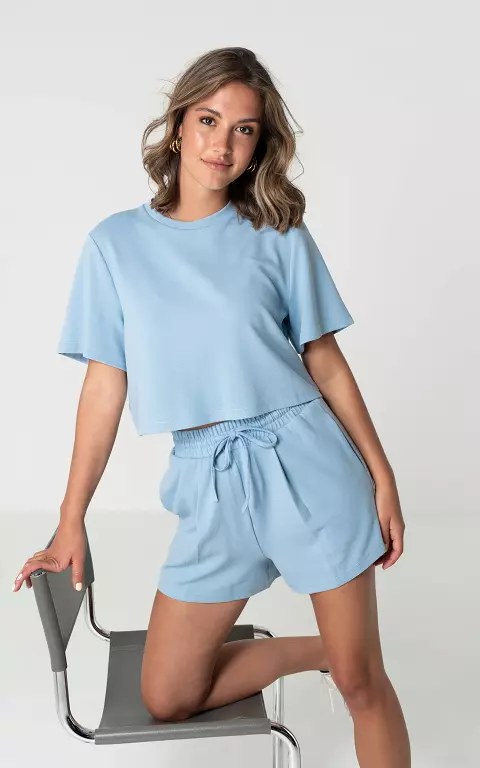 Short with side pockets and bow detail light blue