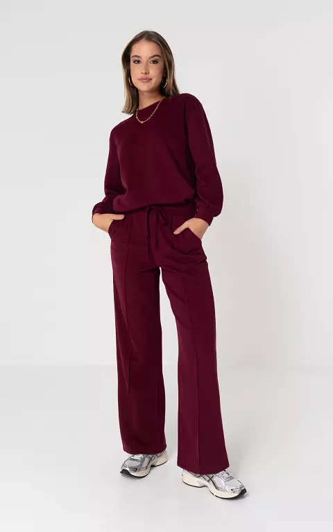 Broek met strikdetail en steekzakken bordeaux